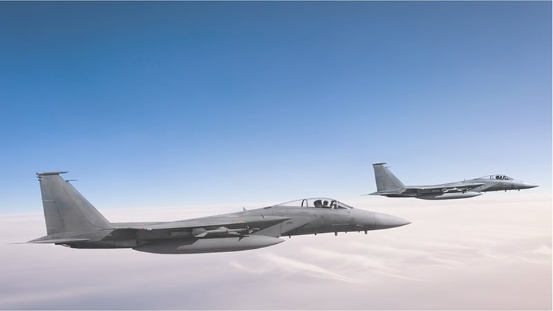 Two fighter aircraft in the air.